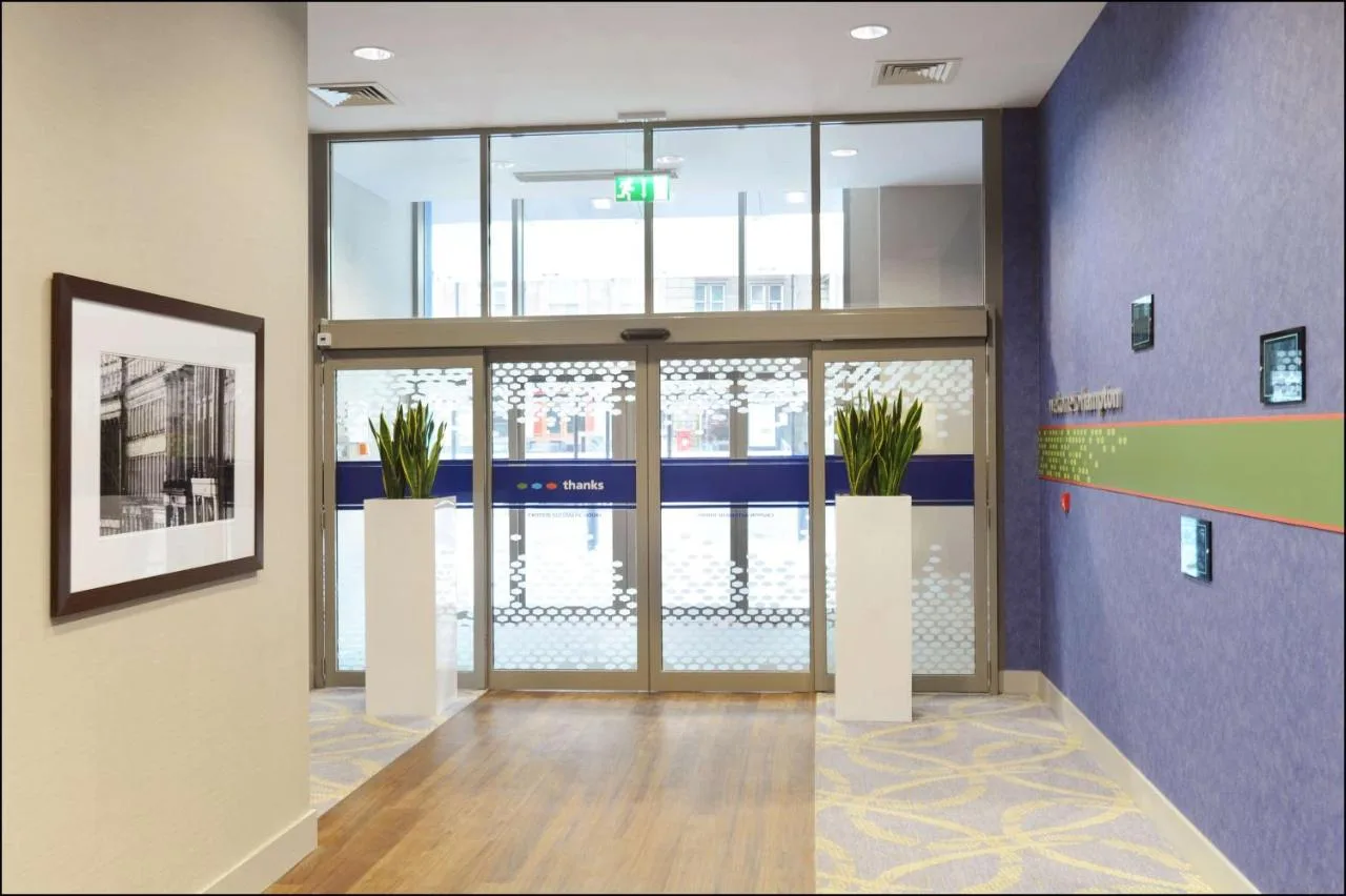 Reception lobby with plants at Hampton by Hilton Newcastle in Newcastle city centre
