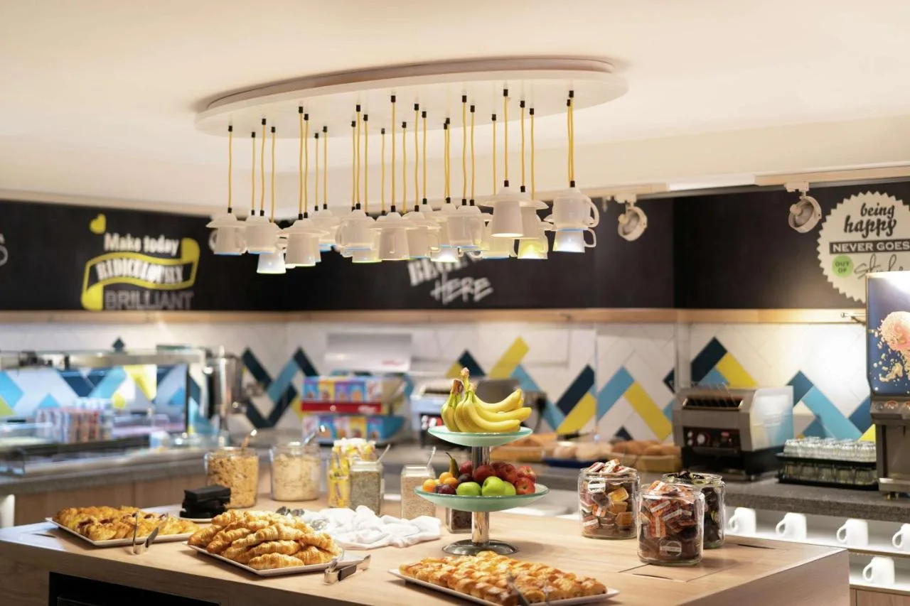 Dining area with chandelier at Hampton by Hilton Newcastle near Central Station