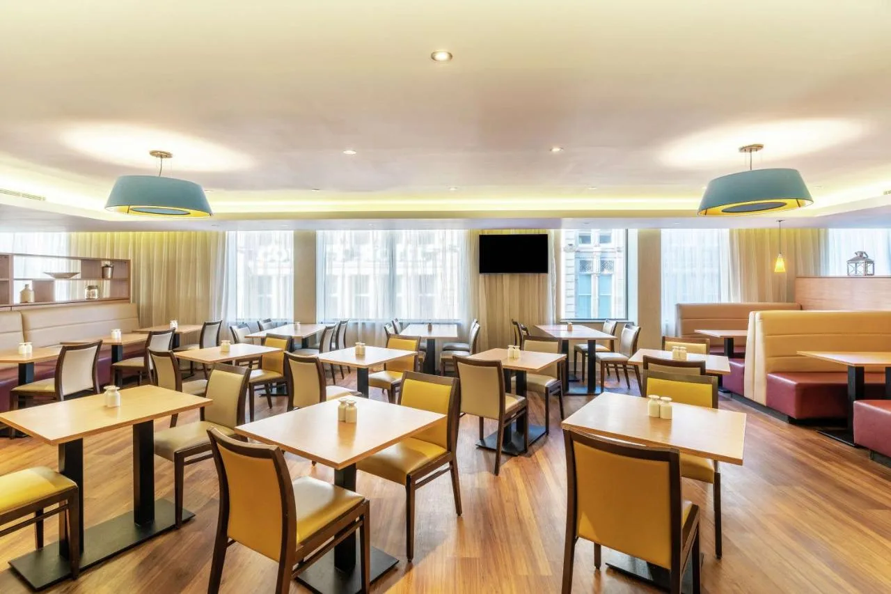 Restaurant seating area at Hampton by Hilton Newcastle opposite the station